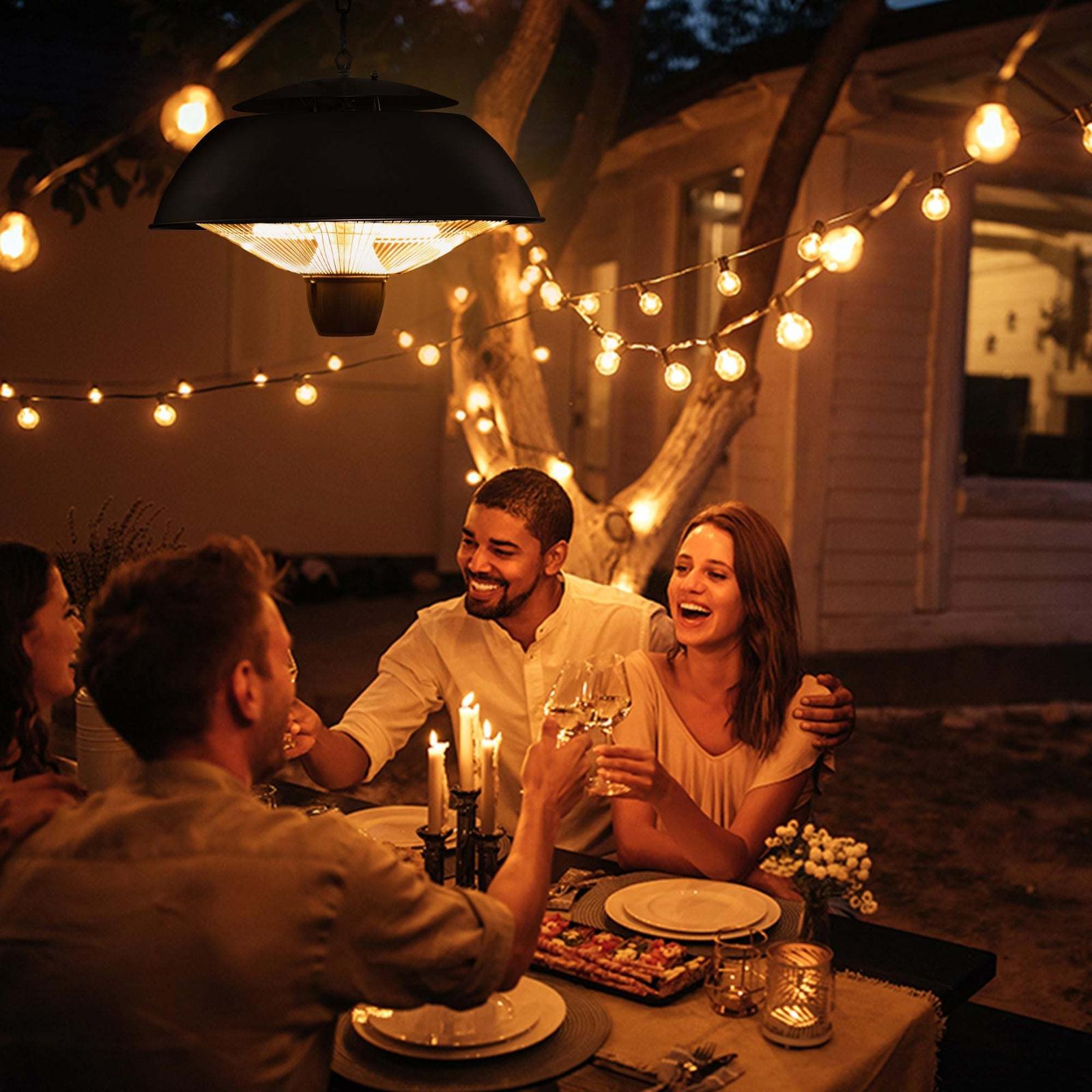 Friends dining outdoors with string lights.