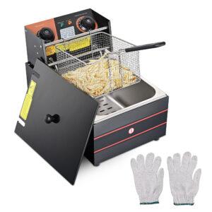 Deep fryer with basket of fries and gloves.