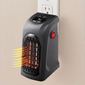 Portable wall-mounted space heater blowing warm air