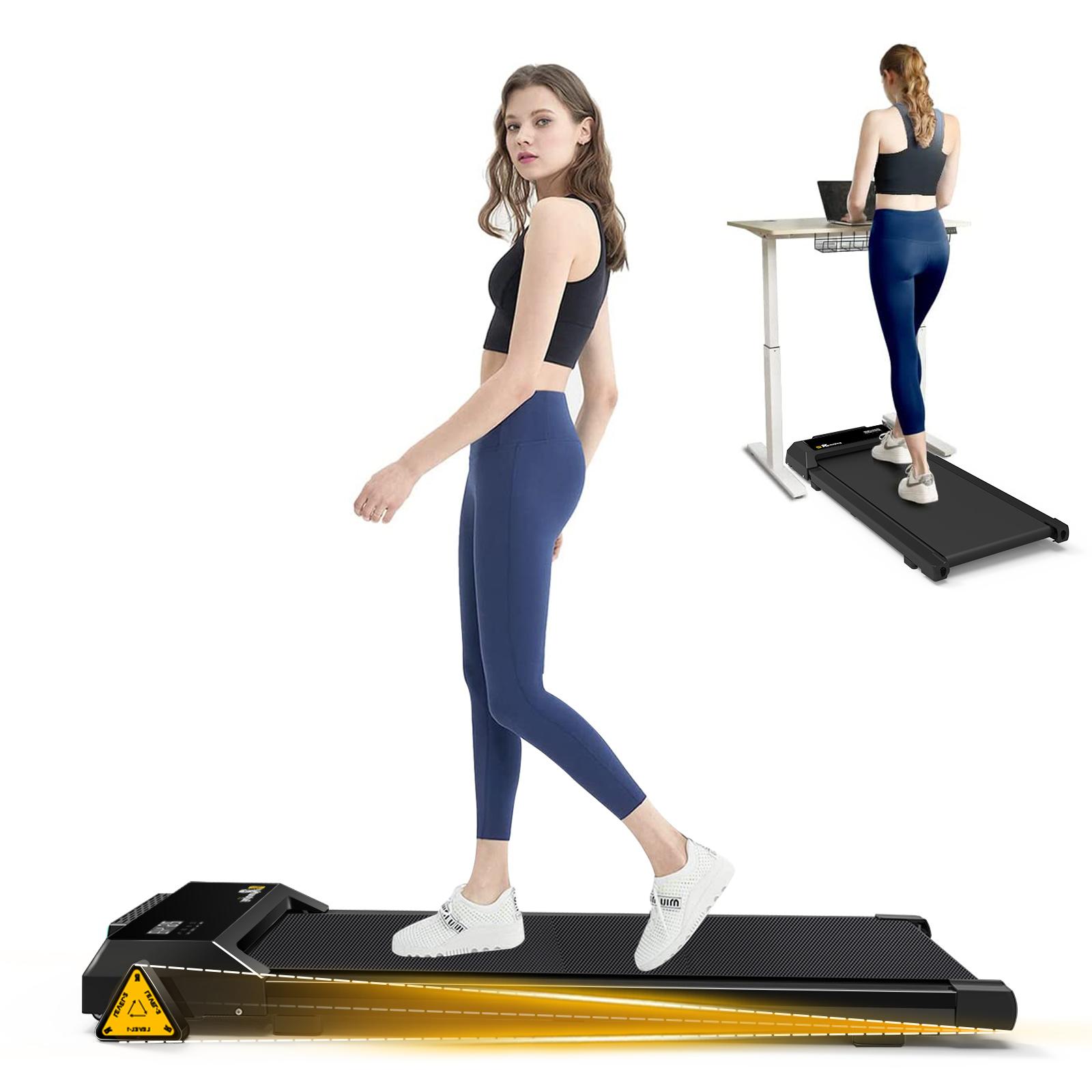 Woman using treadmill for walking and working
