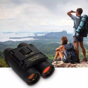 Hikers enjoying scenic view with binoculars.