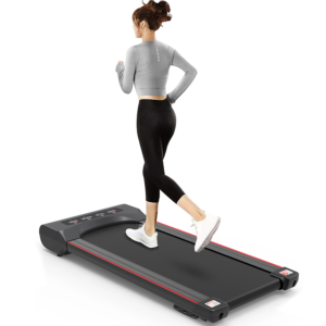 Woman jogging on modern treadmill