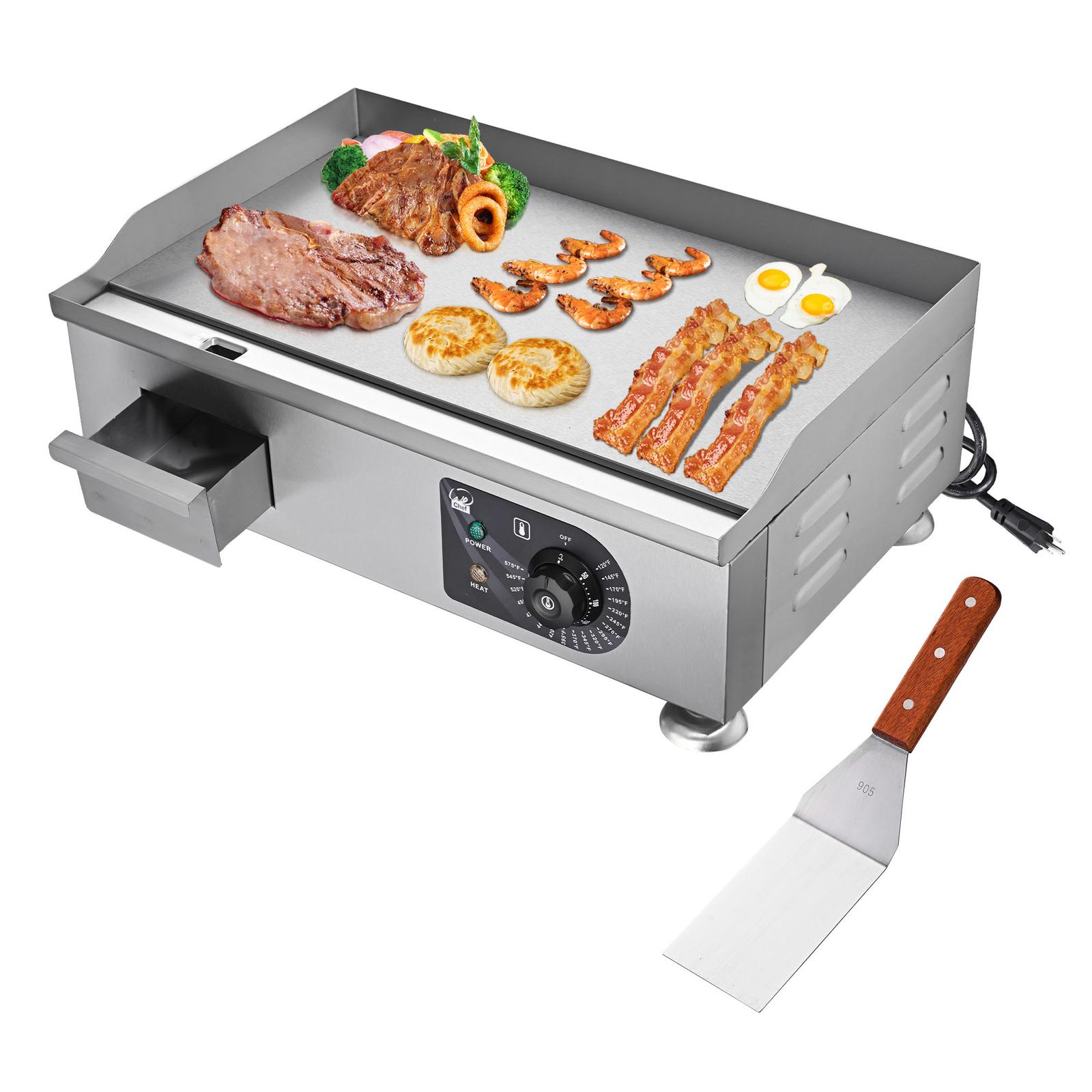 Electric griddle with various foods and spatula