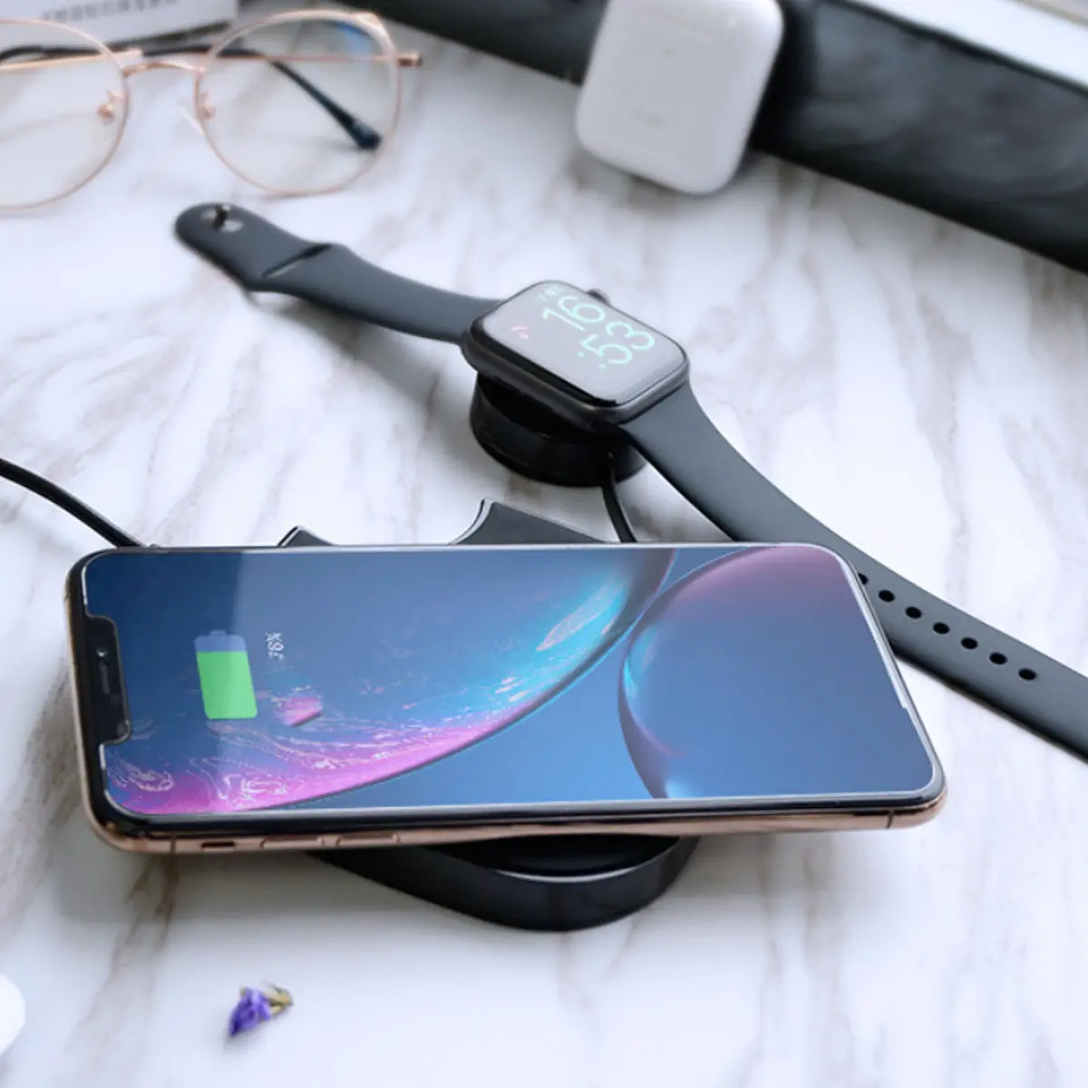 Smartphone and smartwatch on a charging pad