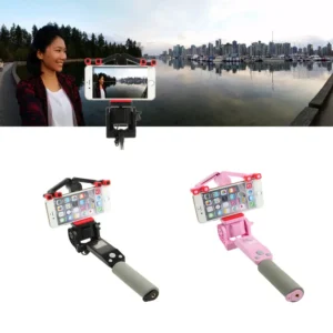 Smartphones on selfie sticks in scenic location.