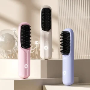 Three hair straightener brushes in pastel colors.