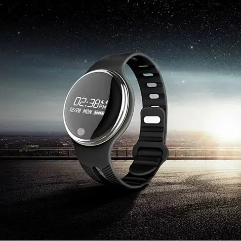 Black digital smartwatch on road at night