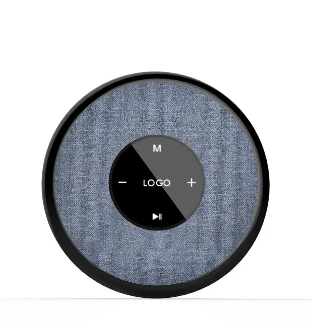 Modern circular Bluetooth speaker with fabric cover