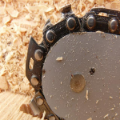 Close-up of saw blade on wood shavings