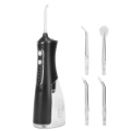 Black cordless water flosser with four tips.